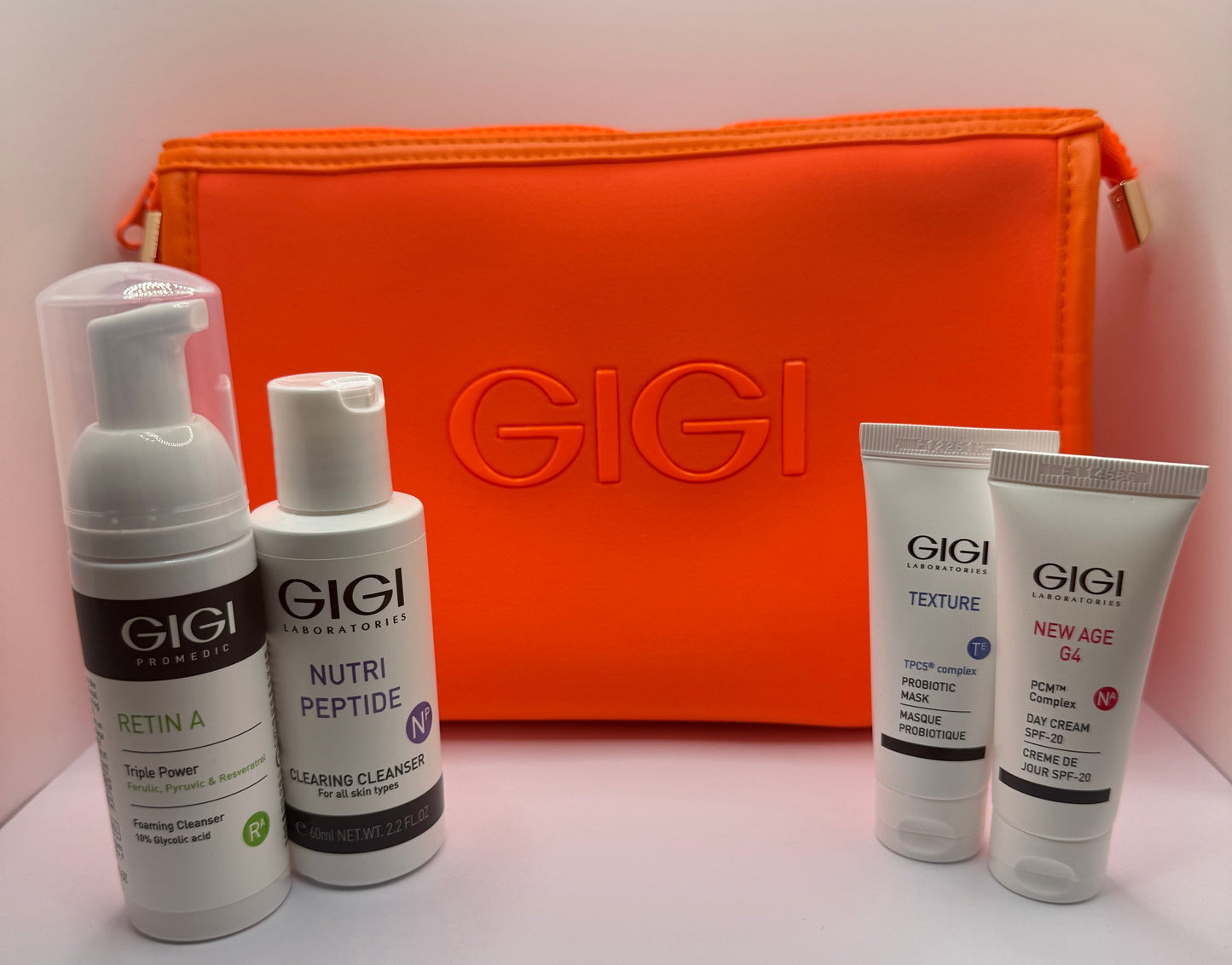 GIGI Travel Set with four skincare products and travel pouch on a clean white background.
