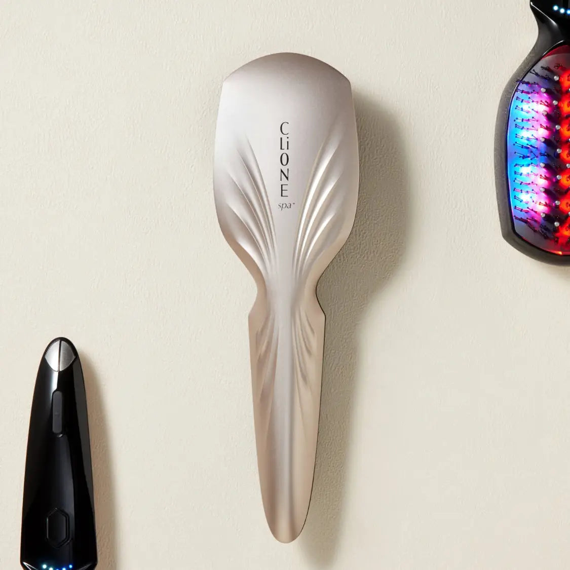 Plamine Clione Spa LED and EMS scalp brush, front view
