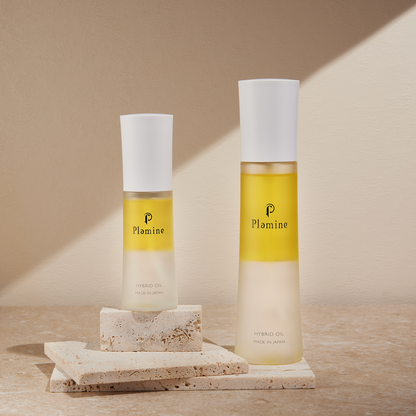 Plamine Hybrid Oil bi-phase face oil bottle on a plain background