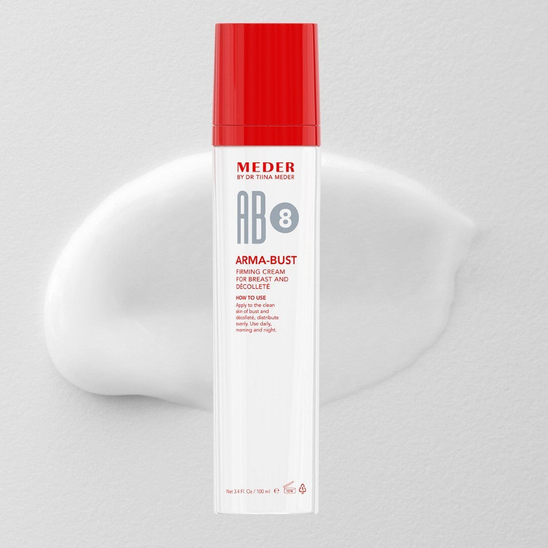 MEDER AB8 Arma-Bust firming cream tube standing upright against a swirl of cream texture on a light grey background