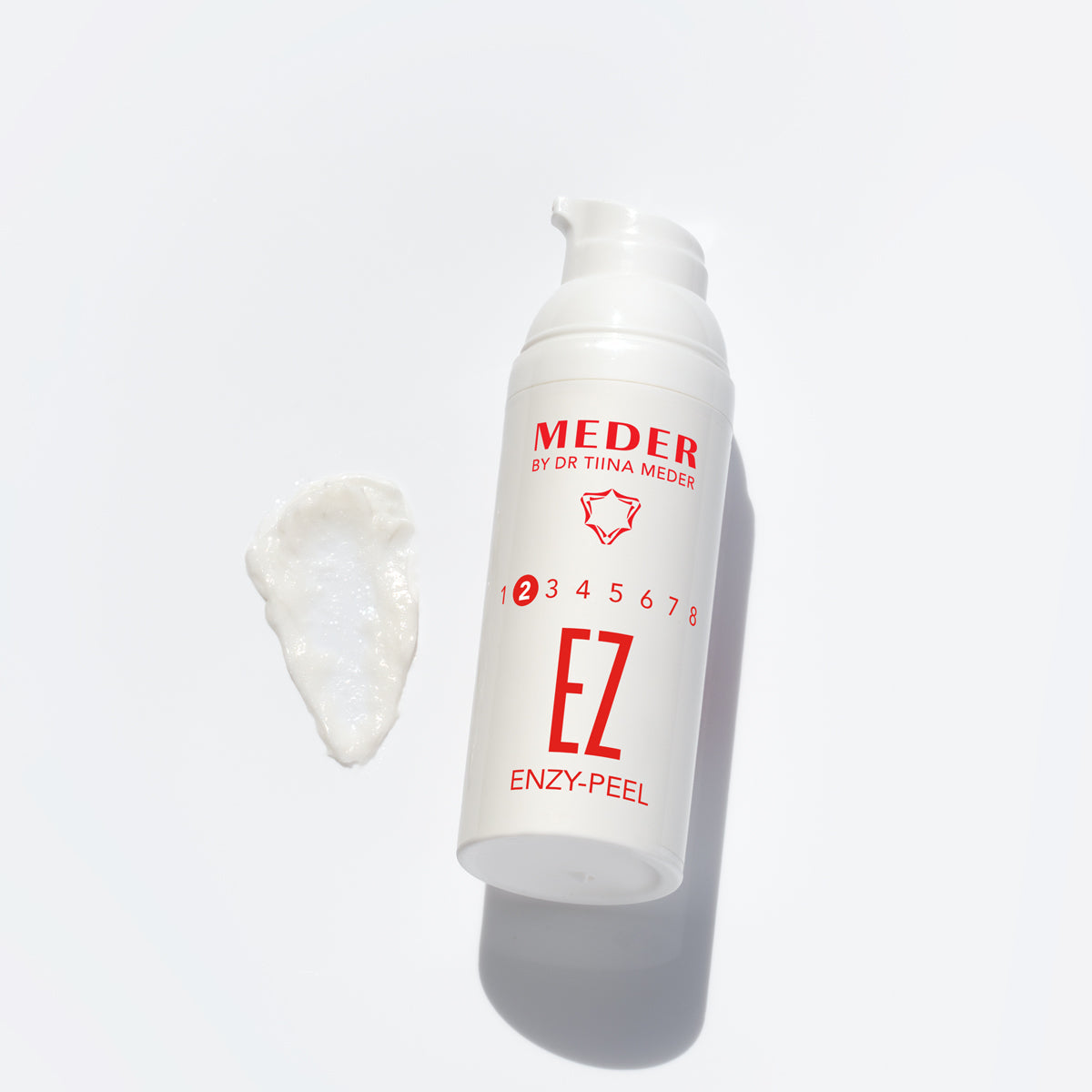 MEDER Enzy-Peel cream texture swatch beside the airless pump bottle
