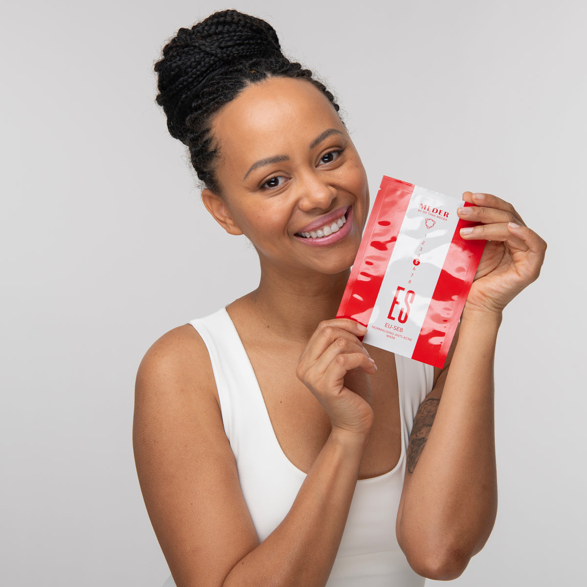 MEDER Eu-Seb Mask single sachet packaging held at an angle