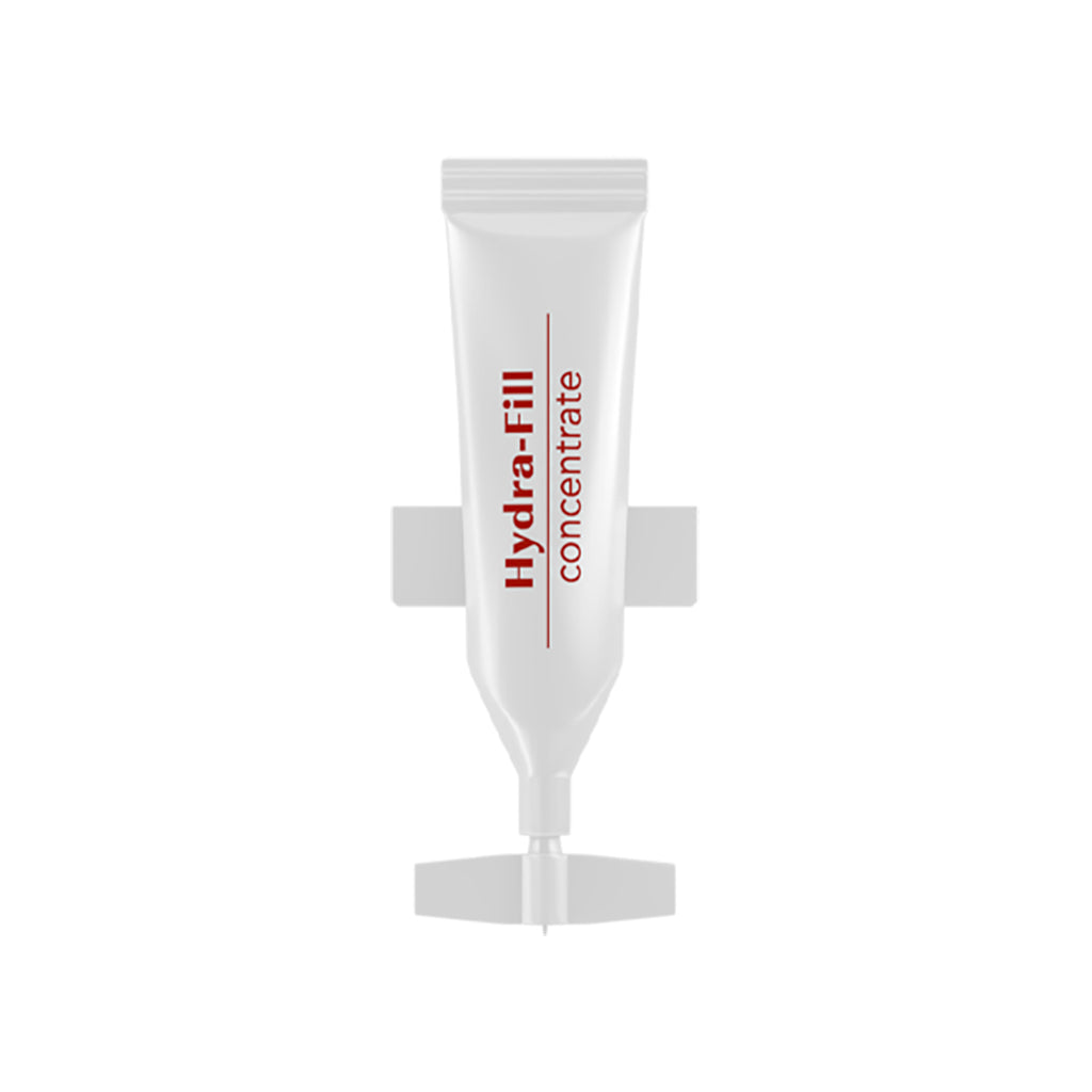 Close-up of the MEDER Hydra-Fill Concentrate red airless pump bottle held in hand