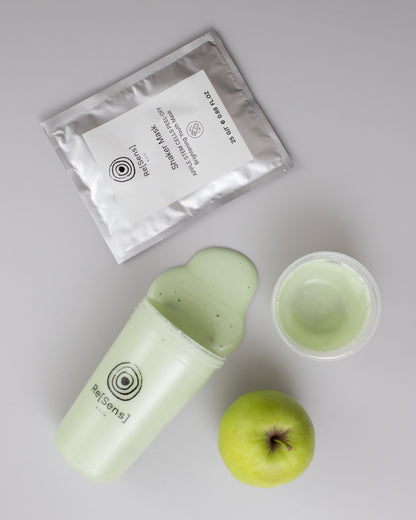 Re[Sens] Apple Stem Cells Peel-Off Shaker Mask alginate paste, shaker and a green apple flat lay